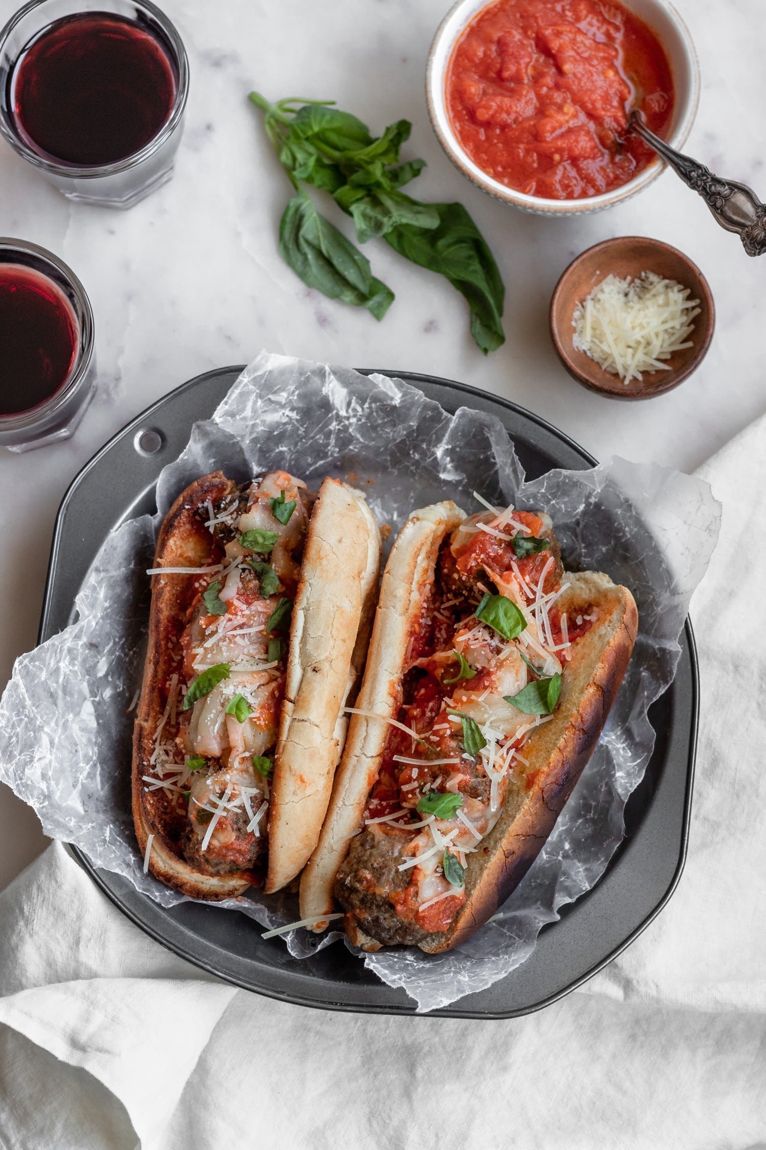 Meatball Subs with fried meatballs and garlicky hoagie rolls.