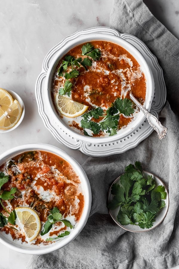 Vegan, gluten-free lentil soup made in a slow cooker and spiced with harissa, garlic, and turmeric.