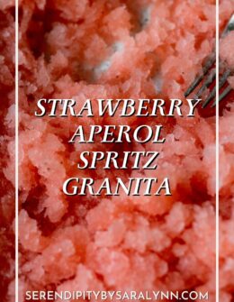 A very closeup image of strawberry aperol spritz granita.