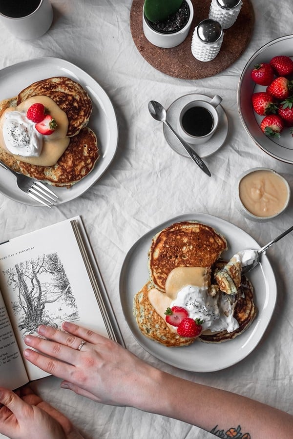 Fluffy and buttery poppy seed pancakes with fresh blood orange curd.