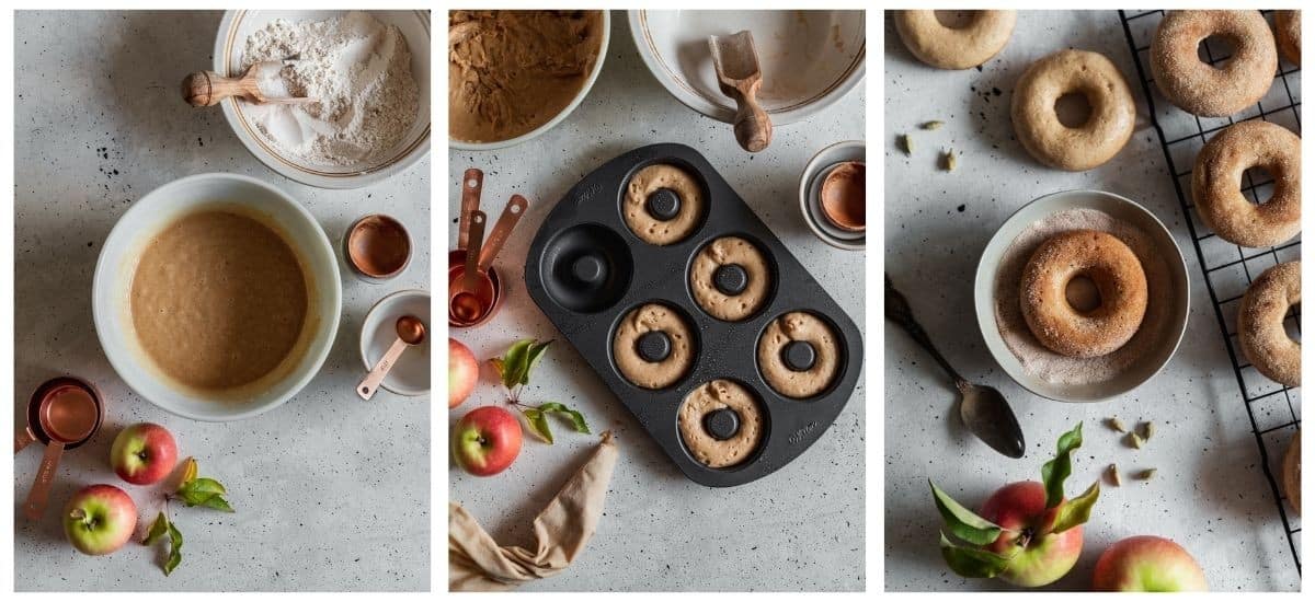 Three overhead images; on the left, a white bowl of batter on a grey table next to a bowl of flour and apples. In the middle, a donut pan filled with batter next to a couple of white bowls, apples, and copper measuring cups. On the right, a closeup of a donut in a bowl with cardamom sugar next to more donuts on a wire rack and a couple of apples.