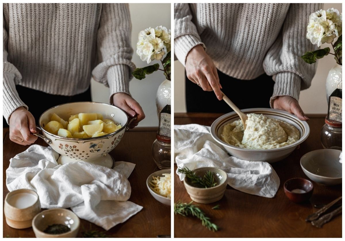 Two images; on the left, a woman wearing a white sweater is holding a colander of potatoes on a wood table next to a white linen, grey bowl of cheese, white bowl of cream, and a white bowl of rosemary. On the right, the woman is stirring cheese and rosemary into the pureed potatoes.
