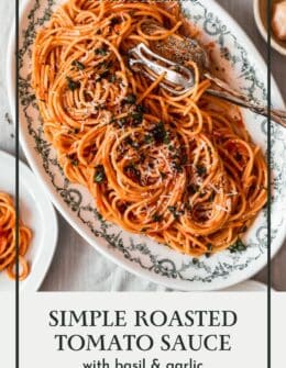 Spaghetti with roasted tomato sauce on a white oval tray.