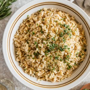 A white bowl with simple rice pilaf with orzo.
