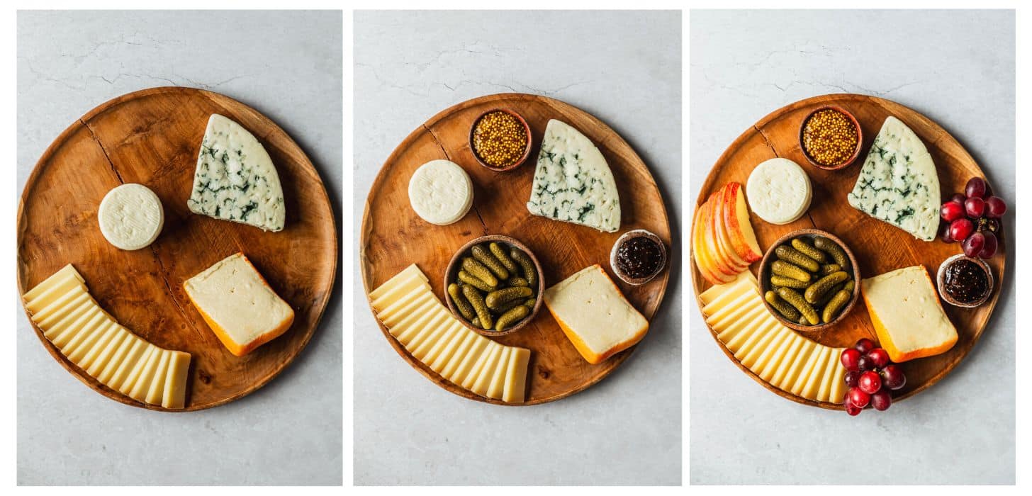 Three steps to building a French cheese board. In photo 1, four cheeses are on a wood platter. In photo 2, brown bowls of mustard, jam, and cornichons are on the board. In photo 3, the board has apples and grapes.