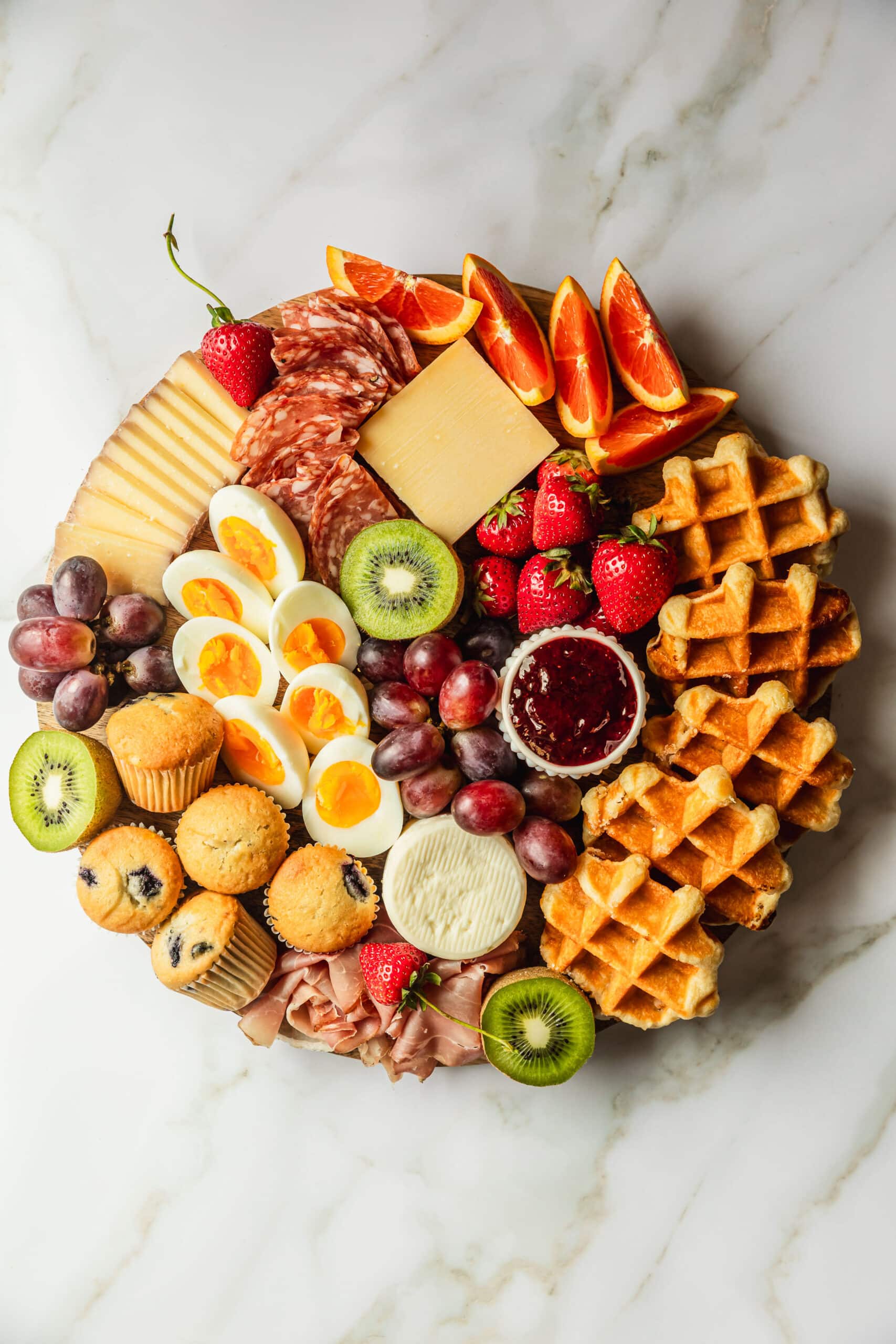 A breakfast platter on a white counter.