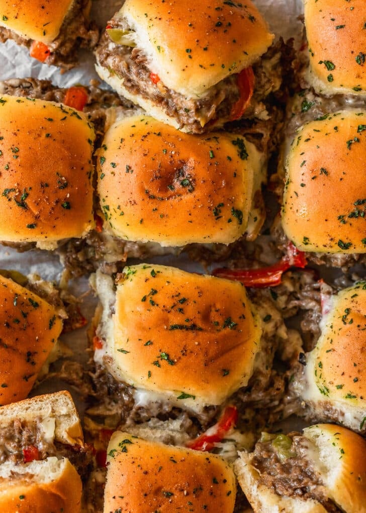 Sliced Philly cheesesteak sliders.