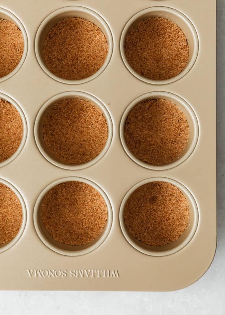 A mini cheesecake pan with graham cracker crust.