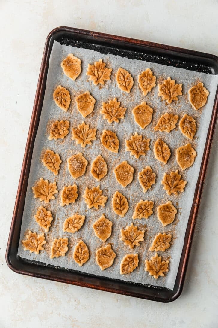 A pan of cinnamon sugar pie crust cookies on a beige counter.
