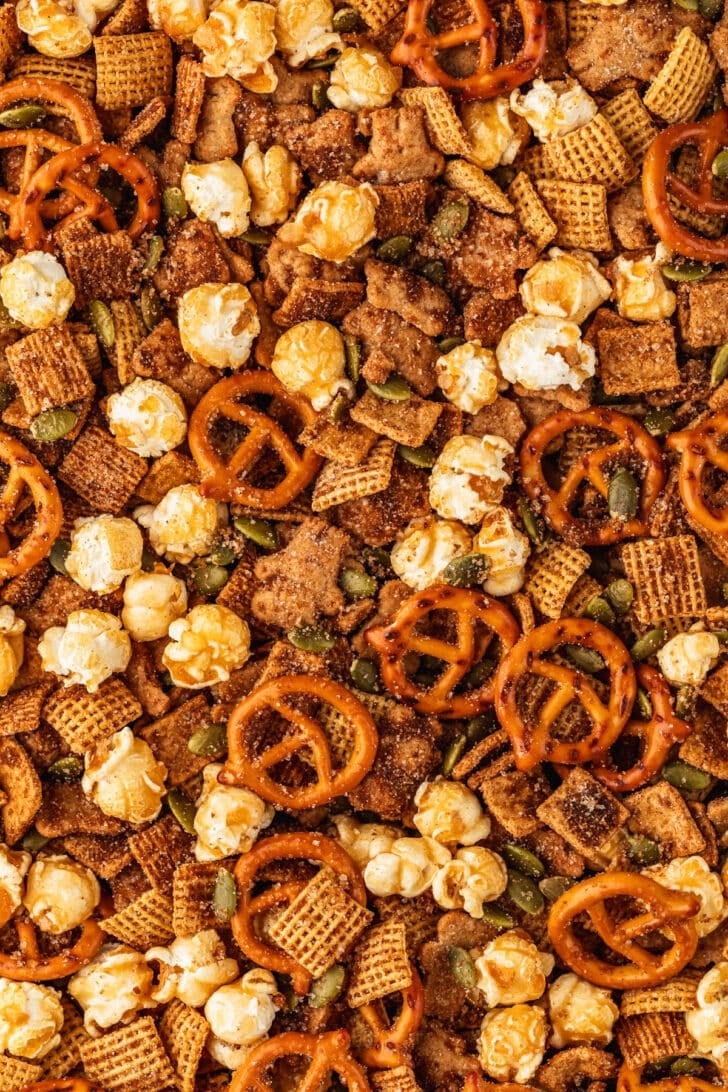 Autumn snack mix with pretzels, cereal, and caramel corn.