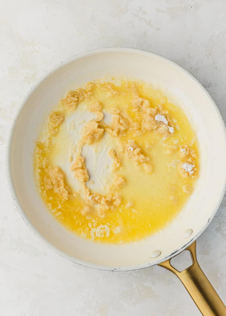 A white pan of butter and flour on a white counter.