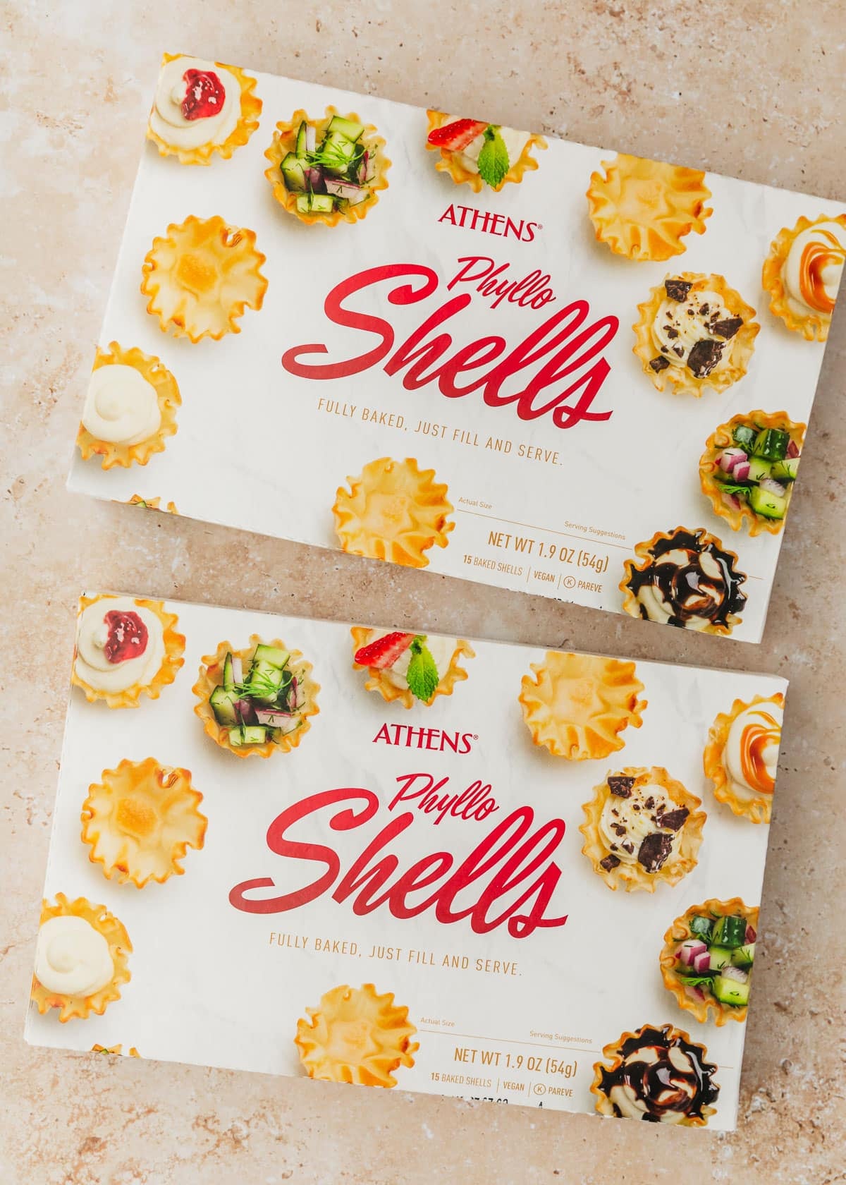 Two boxes of filo shells on a tan counter.
