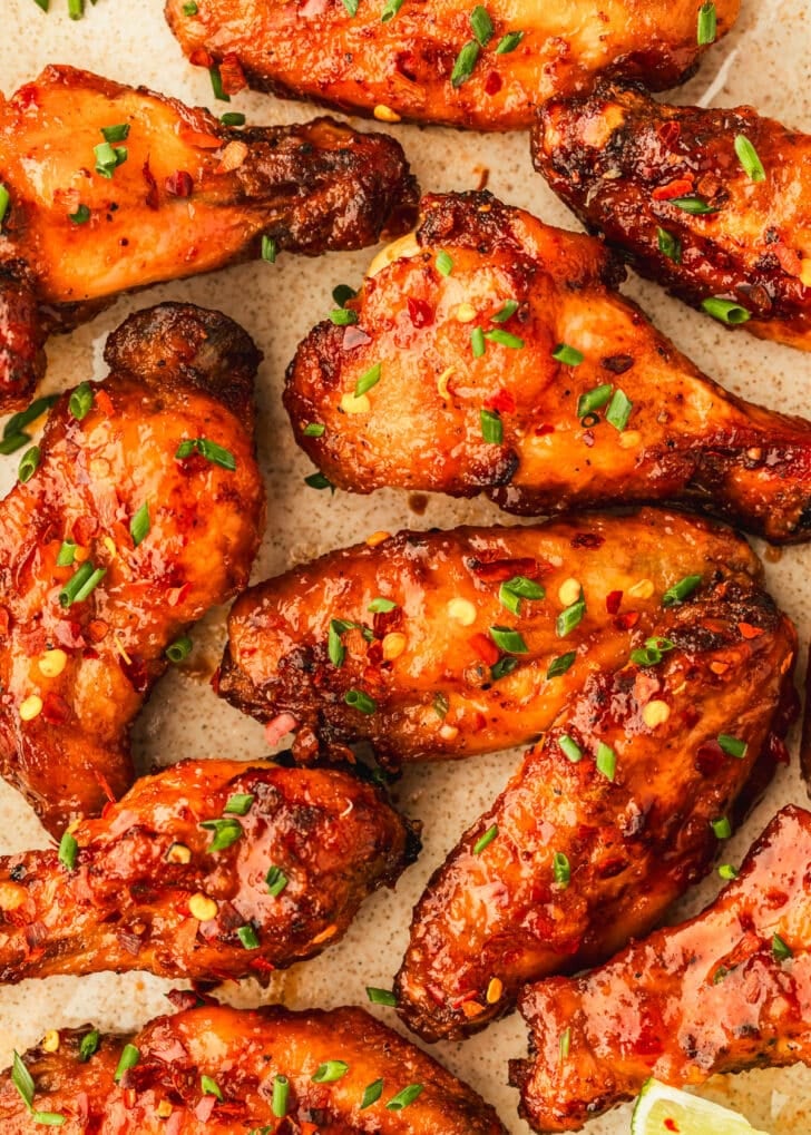 A tan platter of sweet chili chicken wings.