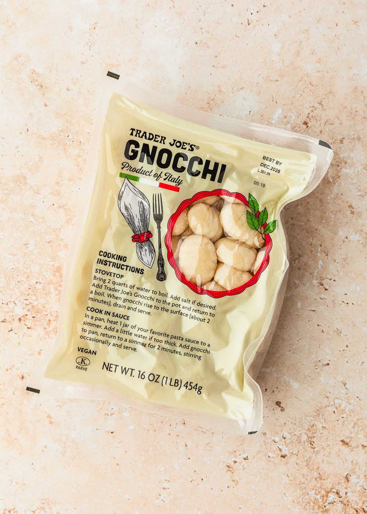 A package of gnocchi on a tan counter.
